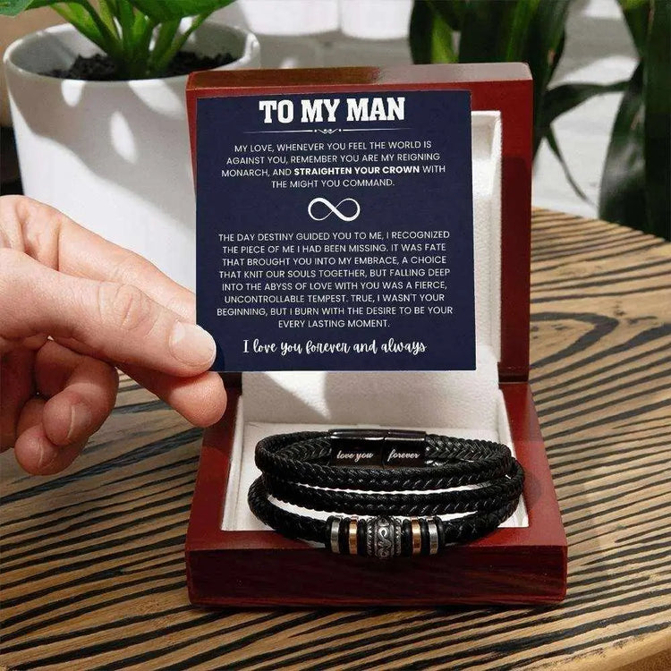 “Black braided vegan leather bracelet for men with stainless steel clasp engraved ‘love you forever,’ presented in a gift  luxury box with message card titled ‘To My Man’ expressing deep love and devotion.”