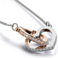 "Close-up of interlocking hearts necklace with rose gold and silver design symbolizing a grandmother and granddaughter bond"
