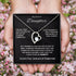 Necklace with heart design held in hands against a blurred floral background