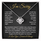 Apology Love Knot Necklace in silver with cubic zirconia stone, displayed on I’m Sorry message card – meaningful reconciliation gift.