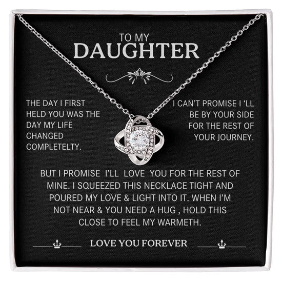 Necklace with sentimental message card for daughter on a black background