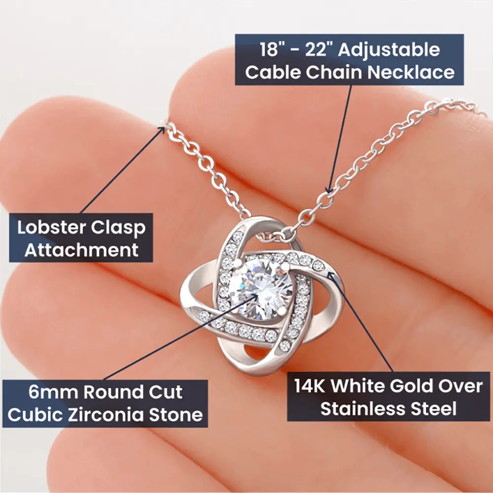 Necklace with lobster clasp and cubic zirconia stone held in hand, labeled with features.