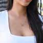 "Granddaughter wearing interlocking hearts necklace with rose gold and silver finish"
