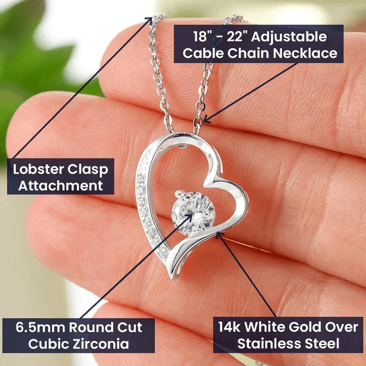 Heart-shaped pendant necklace with adjustable chain held in hand, labeled features and specification.